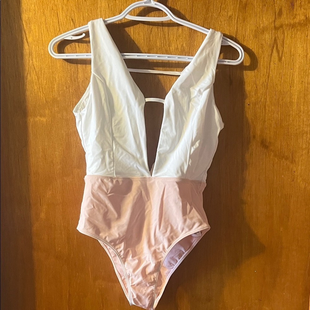 Woman’s Forever 21 White and Light Pink Deep V One-Piece Swimsuit Medium